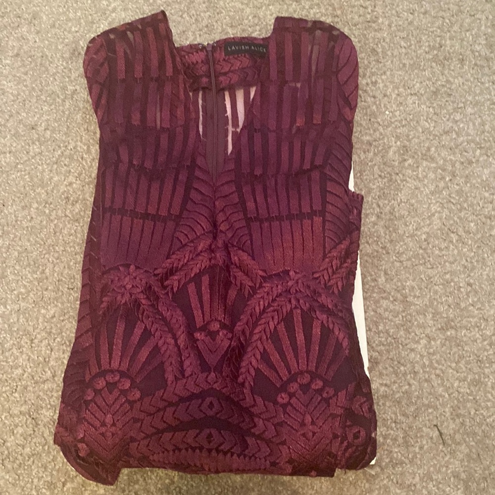 Very long dress a little bit see through. It purple with a pattern.